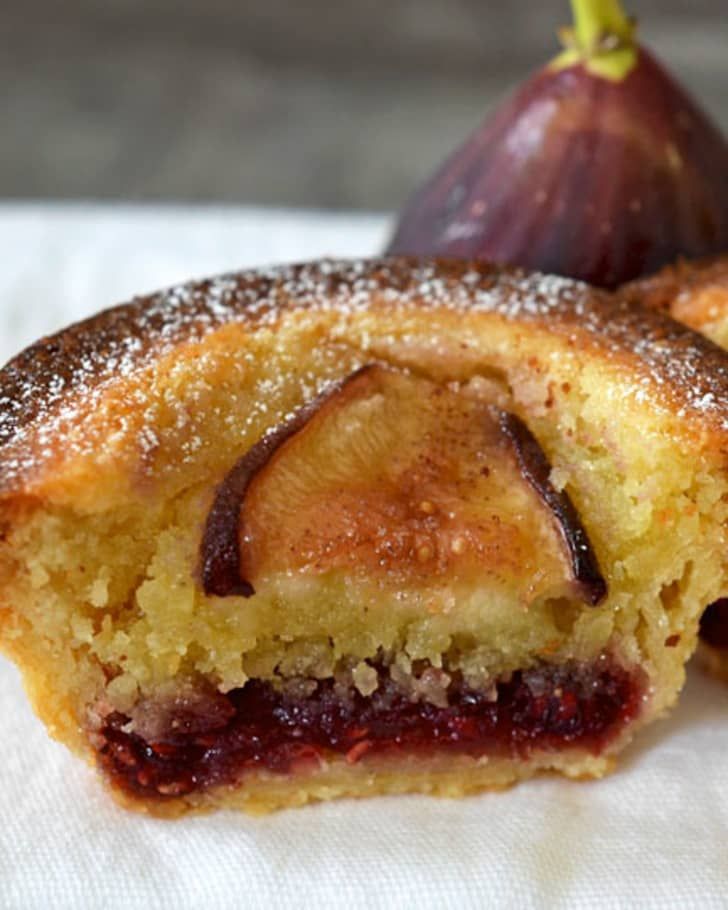 two pastries sitting on top of a white napkin