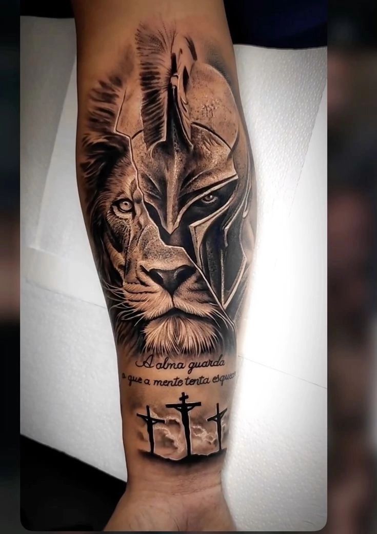 a man's arm with a black and grey tattoo on it, featuring a lion