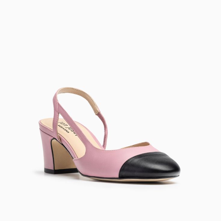 Catch this two-toned capped toe pink and black slingback that's the ultimate combination of form and functionality with its elegant open ankle strap and modest block heel. Leather upper and lining Flexible rubber sole 2 inch heel Made in Spain Pink Slingback Pumps With Sculpted Heel For Evening, Pink Slingback Pumps With Sculpted Heel For Formal Occasions, Pink Slingback Pumps With Sculpted Heel For Formal Events, Formal Pink Slingback Pumps With Sculpted Heel, Evening Leather Slingback Pumps With Rubber Heel Cap, Pink Slingback Pumps With Padded Low Heel, Pink Low Heel Slingback Pumps With Padded Heel, Chic Pink Block Heel Slingback Pumps, Pink Low Heel Block Heels For Formal Occasions