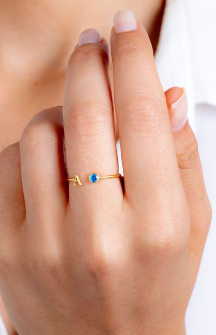 14k Solid Gold Initial Birthstone Ring, Letter Ring,Dainty Ring,Minimalist Ring,Biridesmaid Gift Meterial:14k Solid Gold,14k Gold Filled,925k Sterling Silver, Rose Gold  Dimensions:1mm band / 4mm Letter Height / 3 mm CZ Gemstone  Other styles are available in our shop at https://www.etsy.com/shop/SilverbySelene. Please contact us if you have any questions or requests/ideas for our shop, we'd love to hear from you! Dainty Adjustable Yellow Gold Initial Ring, Dainty Yellow Gold Initial Ring, Adjustable, Gold Dainty Initial Ring With Birthstone, Gold Initial Ring With Birthstone, Adjustable Initial Ring With Open Band For Gift, Gold Dainty Opal Ring Birthstone, Dainty Gold Opal Ring Birthstone, Adjustable Open Band Initial Ring As Gift, Adjustable 14k Gold Opal Birthstone Ring