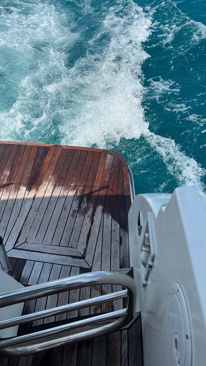 the back end of a boat with water behind it