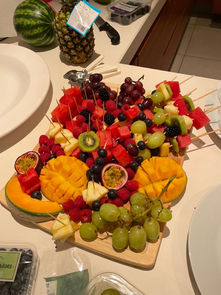 a platter of fruit is displayed on a table