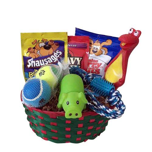 a basket filled with toys and snacks on top of a white table next to a stuffed animal