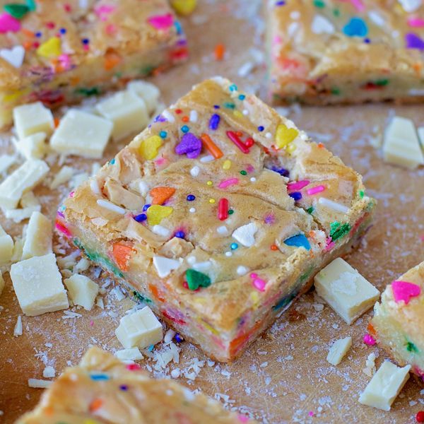 there are many pieces of cake with sprinkles on it