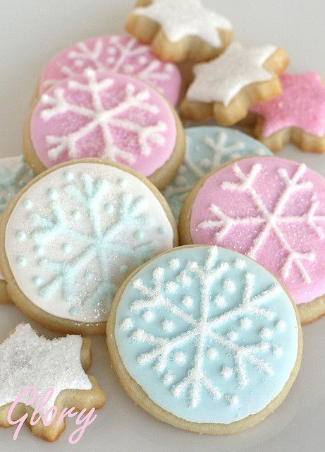 several decorated cookies sitting on top of each other