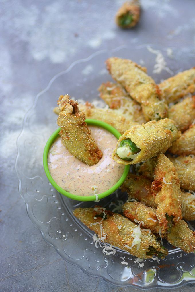 some fried food on a plate with dipping sauce