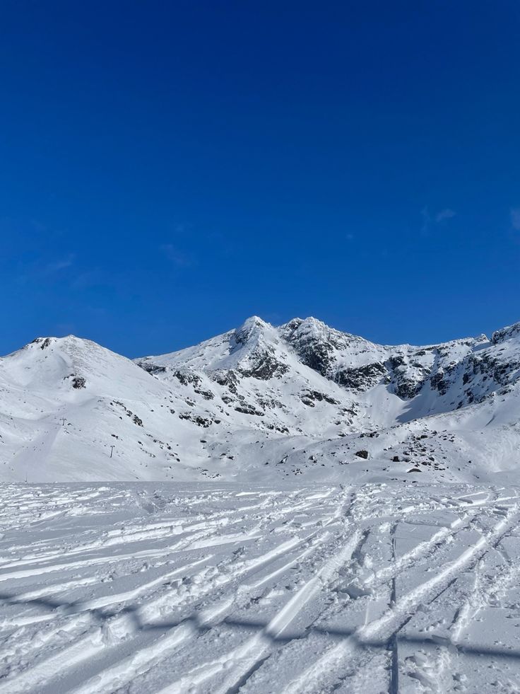 there are many tracks in the snow on this mountain