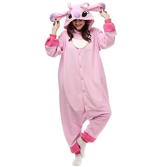 a woman in a pink animal onesuit is posing for the camera