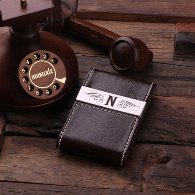 an old fashioned phone and business card case sitting on a wooden table next to a judge's hammer