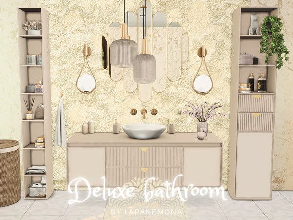 this bathroom is decorated in neutral tones and features gold accents, including mirrors, cabinets, shelves, and a sink