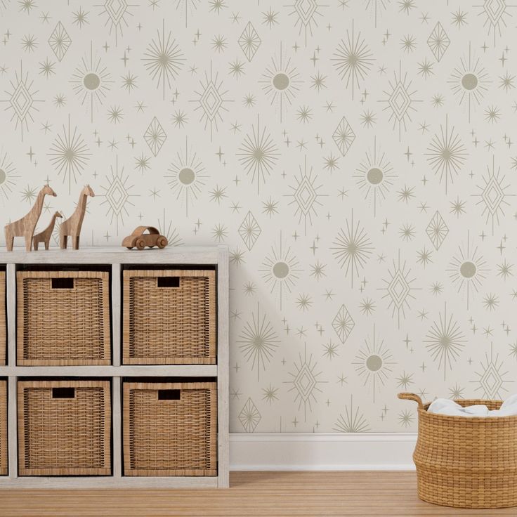 a toy giraffe sitting on top of a wooden dresser next to baskets filled with toys