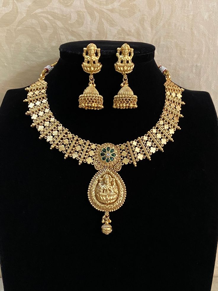 Antique necklace with matte gold finish and earrings beautiful design Festive Gold Temple Necklace With Matching Earrings, Elegant Antique Gold Temple Necklace Gift, Elegant Antique Gold Temple Necklace, Elegant Kundan Necklace In Antique Gold, Elegant Antique Gold Kundan Necklace, Gold Necklace With Elegant Design For Festive Occasions, Elegant Antique Gold Necklaces For Festive Occasions, Gold Jewelry Sets With Matching Earrings For Celebration, Elegant Antique Gold Necklace For Festive Occasions