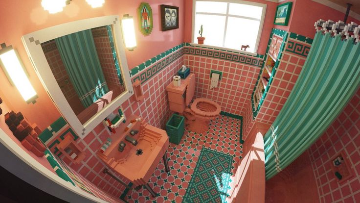 an aerial view of a bathroom with pink and green tiles