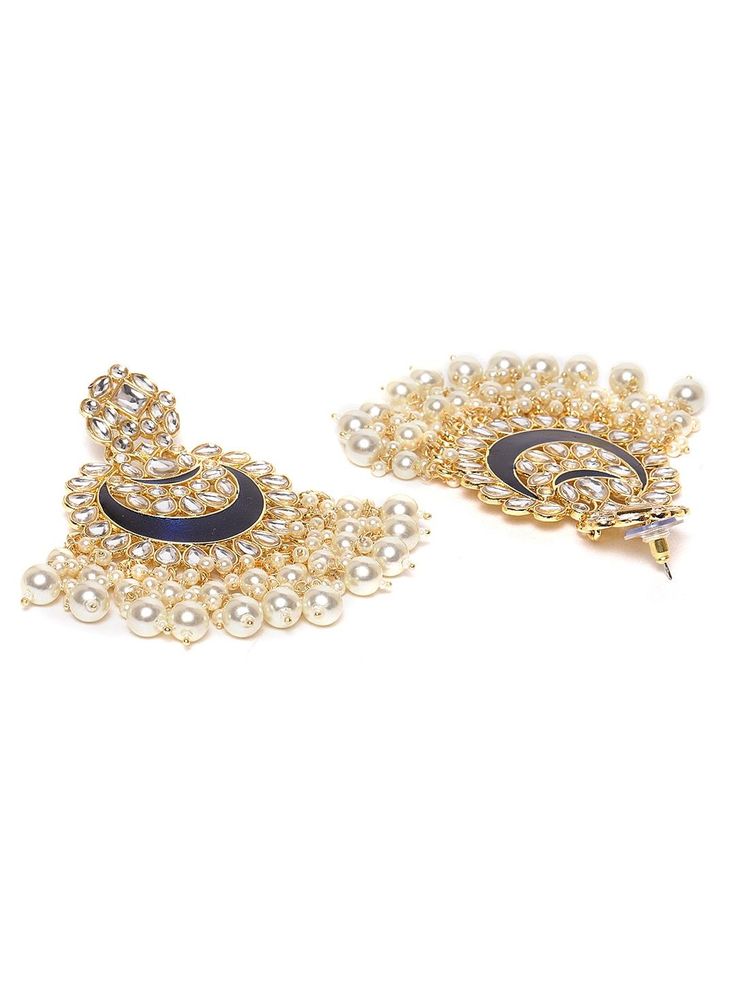 This impressive jewelry set consists of a drop necklace and a pair of chandbali earrings. The multi-stranded, beaded & enamelled necklace shown in dark-blue and off-white color comes gold-plated with kundan stone studs, and secured with an adjustable drawstring closure. A pair of matching chandbali earrings come secured with a post and back closure. This statement piece can add impact to any outfit for any festive occasion! Product color may vary based on the monitor or screen you are using.See Elegant Blue Chandbalis For Festive Occasions, Elegant Blue Chandbalis For Celebrations, Elegant Blue Meenakari Chandelier Earrings, Elegant Blue Kundan Chandbalis, Kundan Chandbali Jewelry With Dangling Beads, Elegant Blue Chandbalis For Diwali, Blue Chandbali Jewelry With Meenakari, Blue Meenakari Chandbali Chandelier Earrings, Chandbali Jewelry With Dangling Beads For Diwali