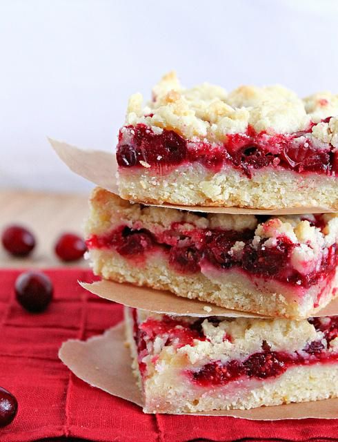 three cranberry bars stacked on top of each other