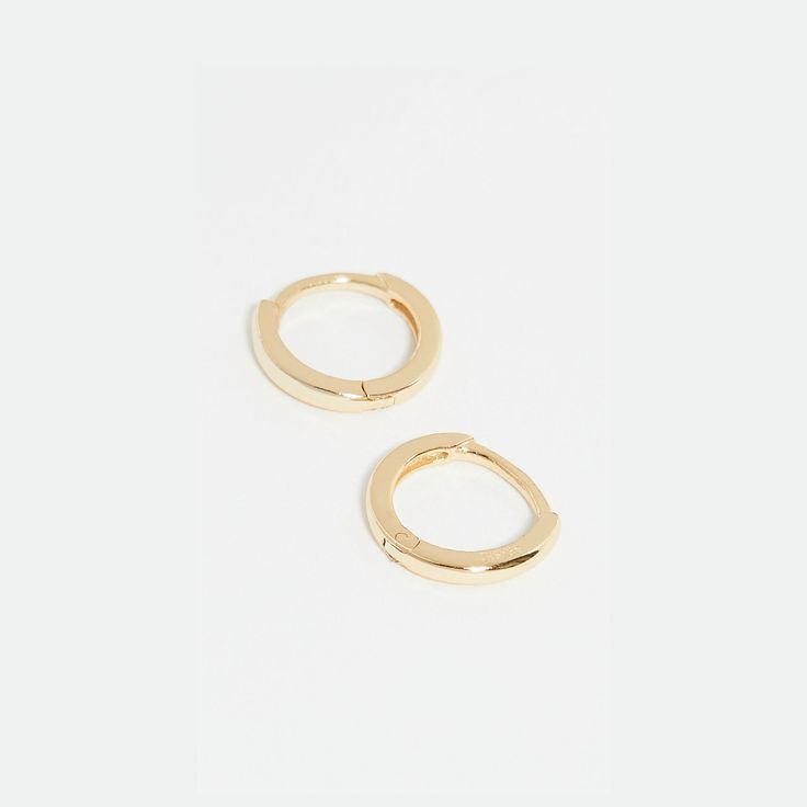 Pure and minimalist, though small, these huggies are impactful in polished gold. Comfortable enough to sleep in, with an easy to wear hinge closure. Vermeil, a thick 18K gold layer on top of sterling silver. Tarnish resistant. Length: 0.4in/10mm Gold Huggie Earrings For Everyday, Simple Gold Huggie Earrings Tarnish Resistant, Everyday Huggie Hoop Earrings, Gold Hinged Huggie Earrings, 14k Gold Minimalist Huggie Earrings, Adjustable 14k Gold Minimalist Huggie Earrings, Simple Gold Small Hoop Huggie Earrings, Simple Gold Huggie Hoop Earrings, Simple Adjustable Huggie Earrings For Everyday