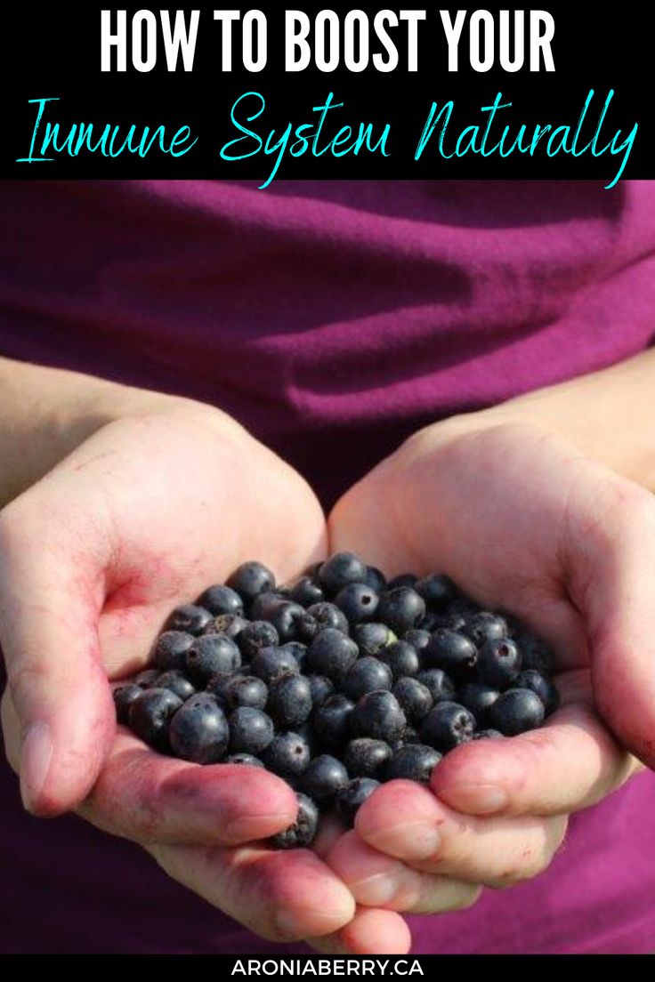 someone holding blueberries in their hands with the words how to booster your immune system naturally