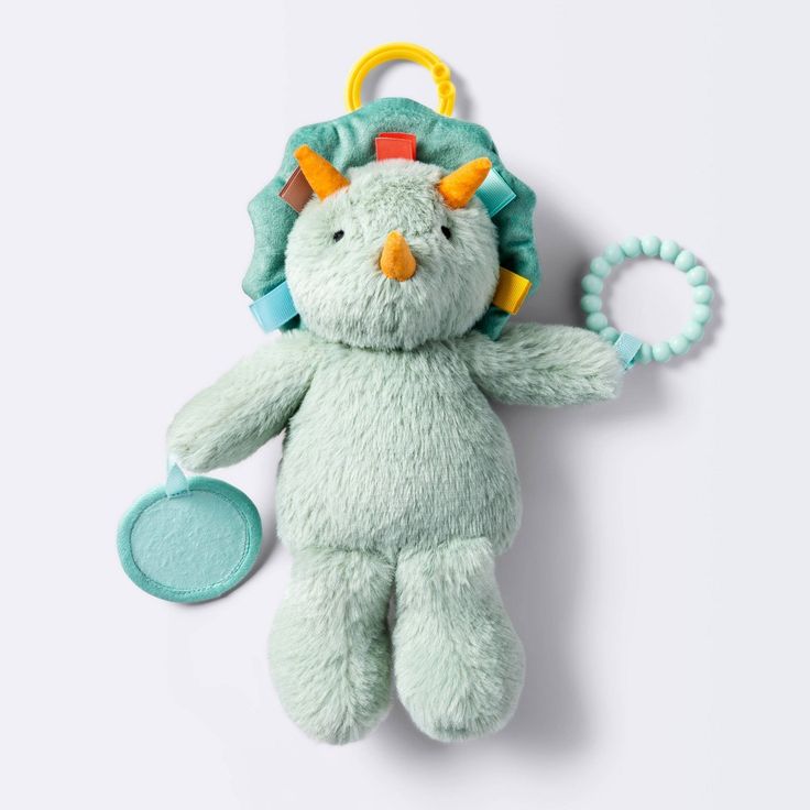 a stuffed animal with a pacifier in it's mouth on a white background