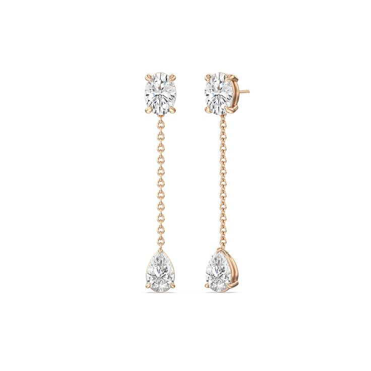 Modern minimalist luxury radiates from this pair of diamond earrings. Each earring glistens with an oval diamond post. Dangling from it is a short linear chain drop with a teardrop diamond at the end. The refined style of this pair makes it perfect for everyday wear and special occasions. Timeless Teardrop Diamond Earrings For Gift, Timeless Pear-shaped Diamond Earrings, Classic Teardrop Earrings With Single Diamond, Classic Drop Linear Earrings With Diamond Accents, Timeless Drop Earrings With Single Diamond, Formal Dangle Earrings With Single Diamond, Formal Single Diamond Dangle Earrings, Timeless Dangle Linear Earrings, Timeless Teardrop Prong Set Earrings