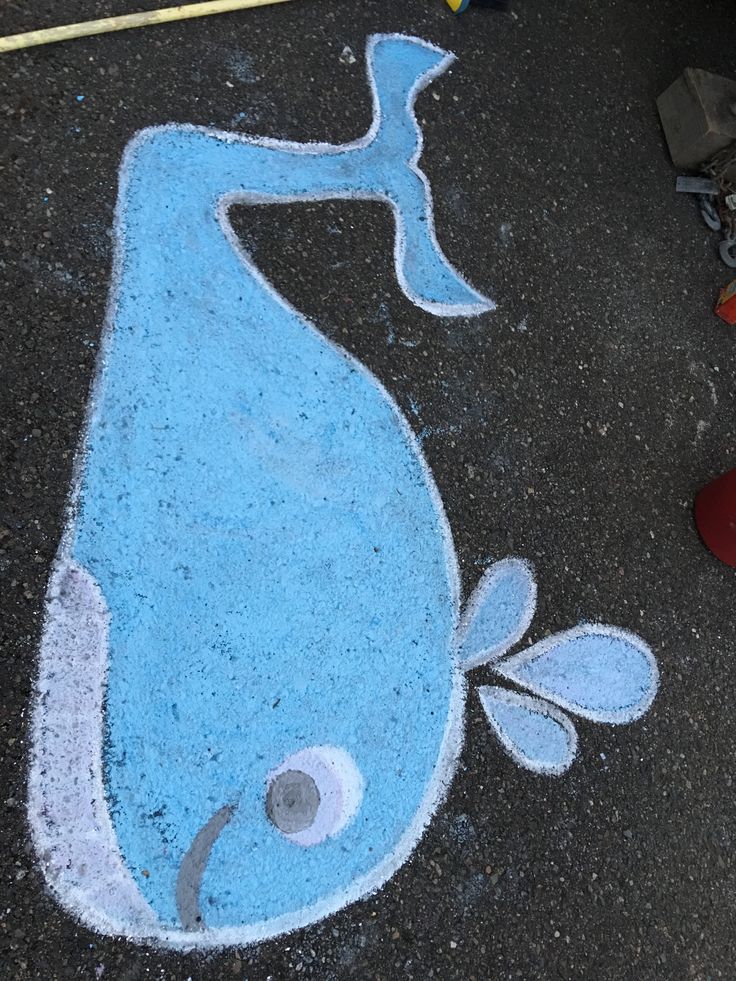 a drawing of a blue whale on the ground