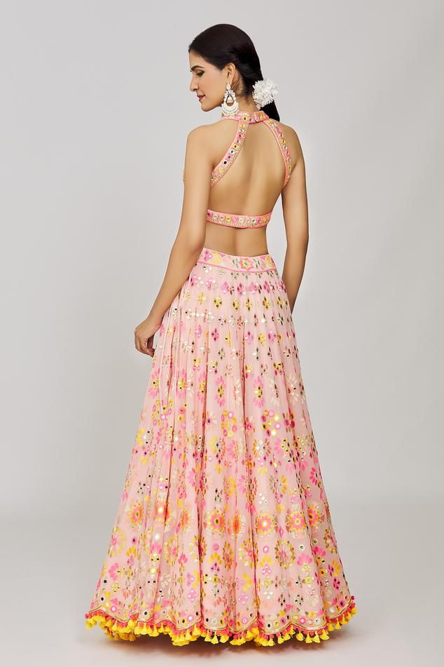 Pink attached cancan lehenga with mirror, sequin, thread embroidery in geometric pattern. Paired with halter neck embroidered padded blouse and scallop bordered dupatta.
Components: 3
Pattern: Embroidery
Type Of Work: Mirror, thread, sequin, geometric
Neckline: Halter neck
Sleeve Type: Sleeveless
Fabric: Lehenga: Georgette, Blouse: Viscose, Dupatta: Organza
Color: Pink
Other Details: 
Lehenga:
Attached cancan
Geometric pattern
Side tassel detailing
Blouse:
Padded
Back cut-out
Dupatta:
Embroidere Sleeveless Party Dress With Cutdana, Sleeveless Anarkali Choli With Sequins, Sleeveless Party Dress With Gota Work, Sleeveless Sequined Lehenga For Diwali, Bollywood Style Sleeveless Sequined Lehenga, Pink Sequin Dress For Navratri, Pink Sleeveless Sequin Set, Sleeveless Lehenga With Resham Embroidery For Party, Summer Lehenga With Cutdana For Reception