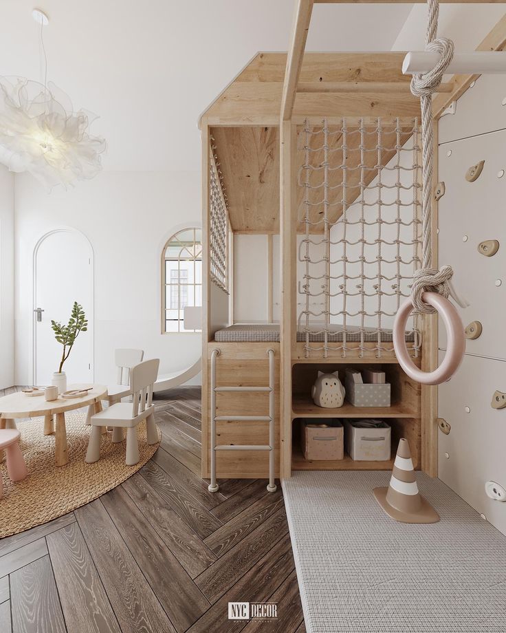 a room with wooden floors and white walls has a loft bed in the middle, while a ladder is on the floor next to it