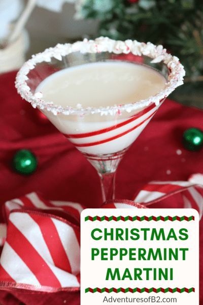 a christmas peppermin martini is garnished with candy canes