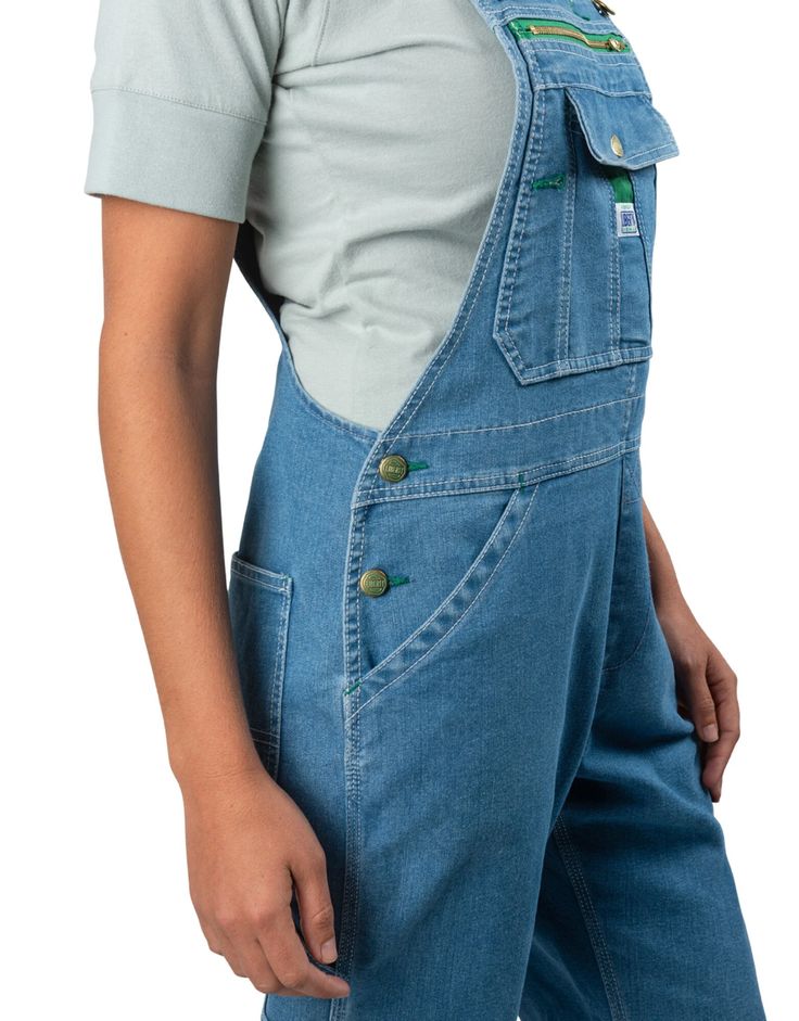 Liberty® Women's Denim Bib Overalls, Stonewashed Light Blue Utility Bib Front Bottoms In Medium Wash, Medium Wash Bib Front Utility Bottoms, Utility Medium Wash Bib Front Overalls, Utility Style Medium Wash Bib Front Overalls, Utility Style Medium Wash Overalls With Bib Front, Denim Bib Front Shortalls For Work, Medium Wash Bib Front Overalls For Work, Utility Style Medium Wash Shortalls, Utility Denim Bib Front Shortalls