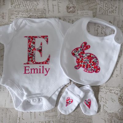 two personalized onesuits and booties are shown with the name e on them