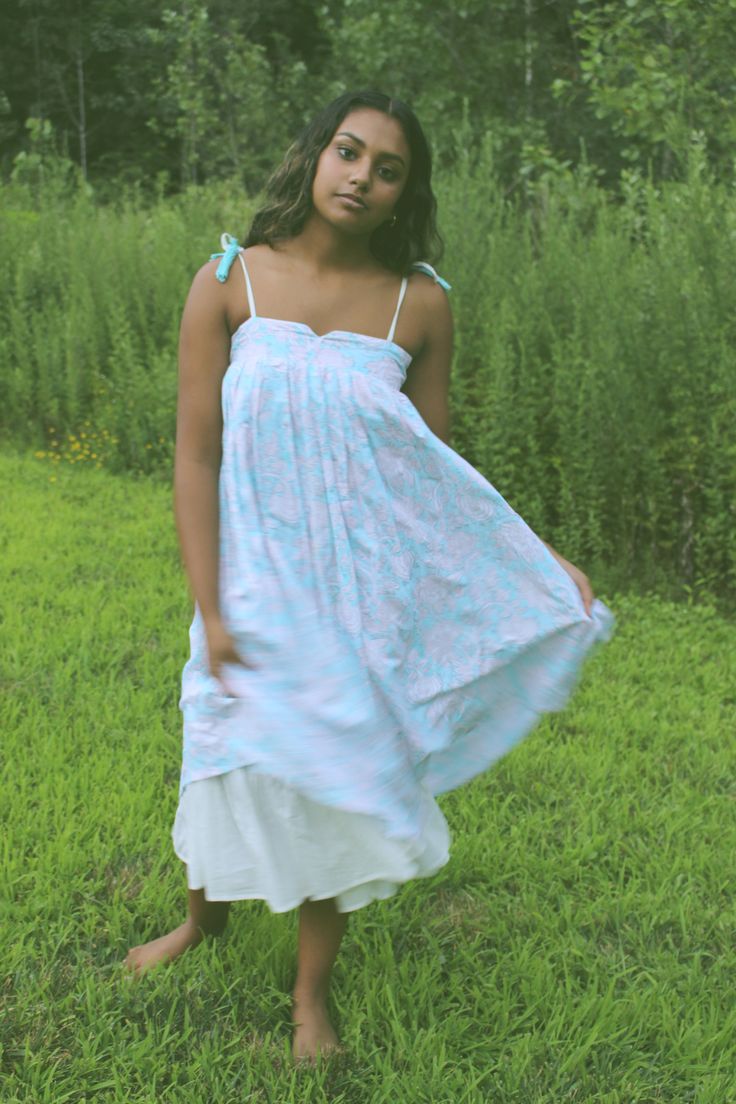 This dress is a boho dream. Embrace the slow craft of our nature inspired handblock printed hemp and bamboo dress, dyed with organic love. The organic cotton lining of the dress adds to flow and gives a ruffled accent around the edges of the dress and pockets. The print is created using organic dyes and hand carved wooden blocks by the artisans of Jaipur, India. The garment is sewn by women of Sewing the Seeds social enterprise. Hand crafted in India Relaxed Cotton Dress For Garden Party, Relaxed Fit Cotton Dress For Garden Party, Spring Flowy Dresses With Natural Dye, Flowy Spring Dresses With Natural Dye, Breezy Cotton Daywear Dresses, Breezy Cotton Day Dresses, Flowy Spring Maxi Dress With Natural Dye, Flowy Natural Dye Maxi Dress For Spring, Casual Cotton Dresses For Gatherings