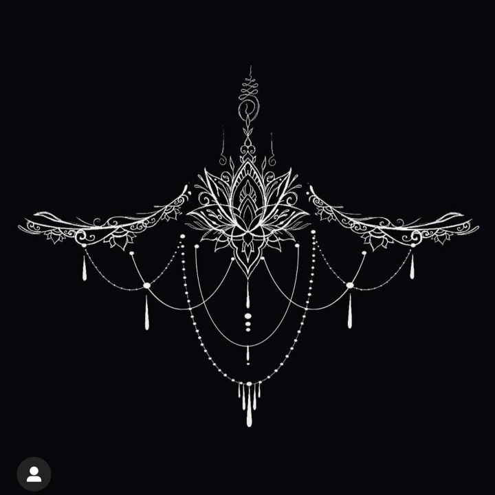 a chandelier hanging from the ceiling in front of a black background with an intricate design