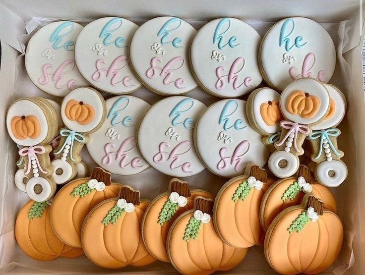 some cookies are in a box and have pumpkins on them with the names of each child's name