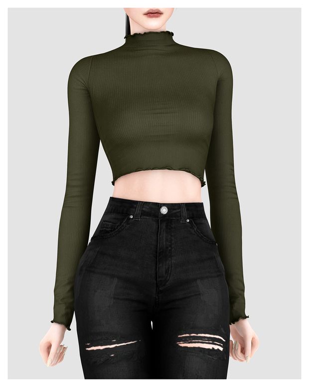 a woman wearing black ripped jeans and a green cropped top with cutouts on the sides