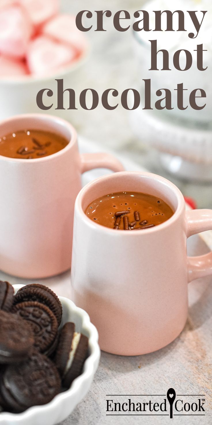 Two pink mugs filled with creamy hot chocolate with a bowl of oreo cookies with text overlay. Rich And Creamy Hot Chocolate, Hot Chocolate Recipes Stovetop, Stovetop Hot Chocolate, Stovetop Hot Chocolate Recipe, Rich Hot Chocolate Recipe, Creamy Hot Chocolate Recipe, Creamy Hot Chocolate, Hot Chocolate Milk, Hot Chocolate Cocoa