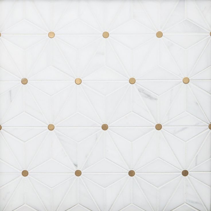 a white wall with gold dots on it