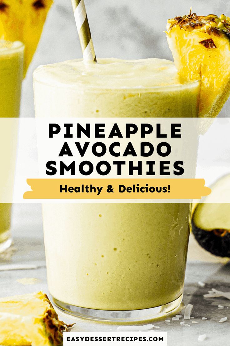 pineapple avocado smoothie in a glass with a striped straw