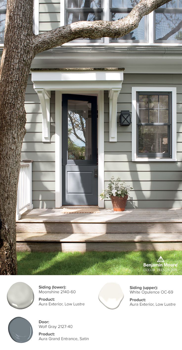 a house with gray siding and white trim