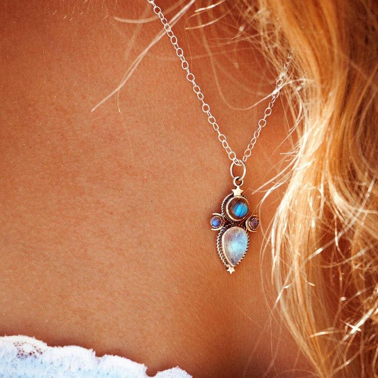 This mystical and celestial necklace will add a touch of magic to your look! Made with Labradorite and Moonstone gems, this sterling silver necklace features crescent moons and stars inspired by the cosmos. Labradorite can symbolize self-love, spiritual protection and intuition. As well, Moonstone can symbolize the divine feminine, clarity, intuition and the moon phases. *Our jewelry features natural, genuine gemstones, ensuring each piece is unique and one-of-a-kind. Please note that, as no two Mystical Sterling Silver Crystal Necklace With Moon Charm, Spiritual Sterling Silver Moon Phase Necklace, Bohemian Moon Shaped Jewelry With Natural Stones, Bohemian Moon Phase Necklace In Sterling Silver, Bohemian Sterling Silver Moon Phase Jewelry, Bohemian Sterling Silver Moon Phase Necklace, Bohemian Sterling Silver Pendant Charm Necklaces, Bohemian Pendant Necklaces With Birthstone, Celestial Sterling Silver Crystal Necklace With Moon Charm