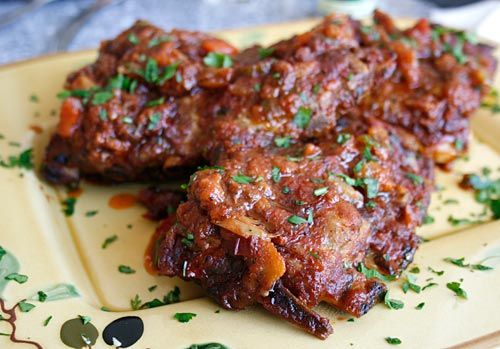 chicken wings with cilantro and parsley on a plate