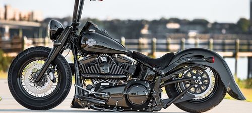 a black motorcycle is parked on the street