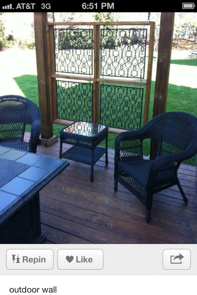 two chairs sitting on top of a wooden deck next to a table and chair set