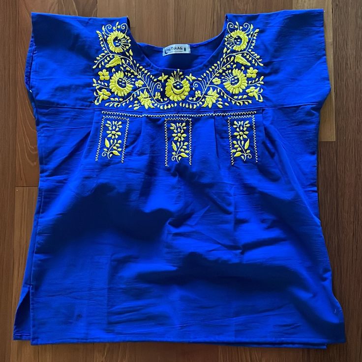 Cobalt Blue Top With Yellow Floral Embroidery. Size M. 23” Across, 25” Shoulder To Hem. Brand New, Never Worn. From Smoke Free Pet Free Home. Spring Blue Geometric Embroidered Blouse, Blue Embroidered Cotton Tops, Blue Tops With Geometric Embroidery For Spring, Spring Blue Embroidered Top, Blue Cotton Embroidered Short Sleeve Top, Blue Cotton Blouse With Geometric Embroidery, Casual Blue Blouse With Geometric Embroidery, Blue Geometric Embroidered Summer Top, Blue Geometric Embroidered Top For Summer