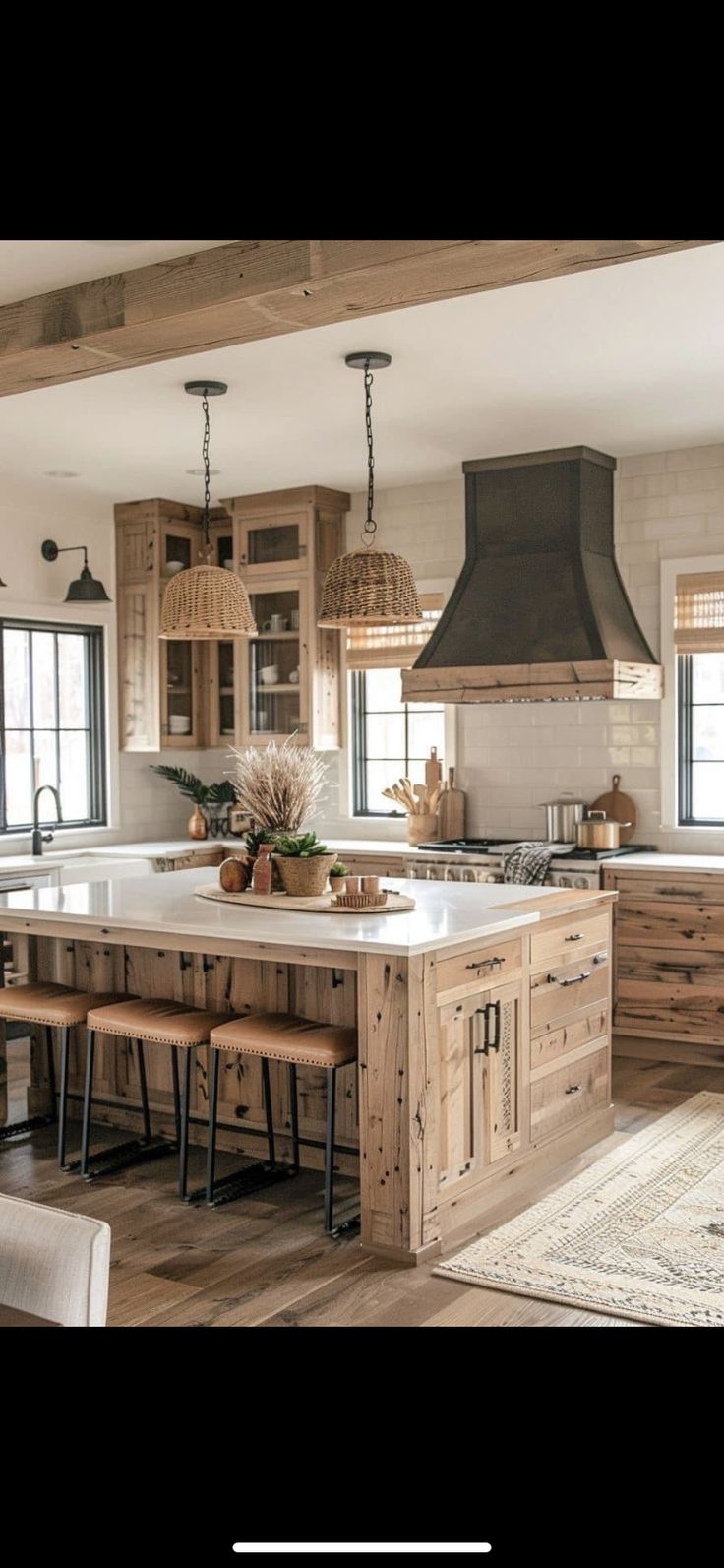 a large kitchen with wooden cabinets and an island