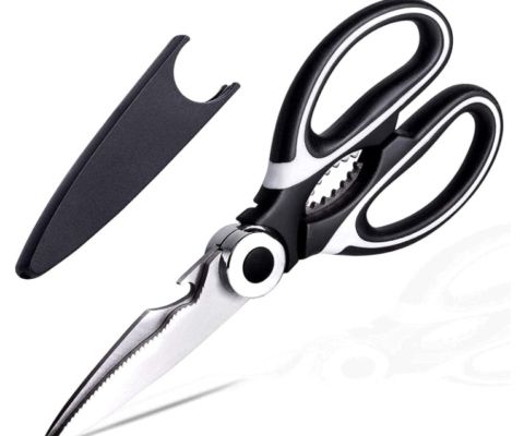 a pair of scissors and a knife on a white background