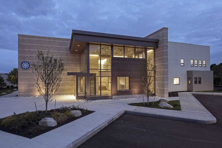 a large modern house lit up at night