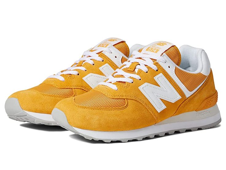 New Balance Classics ML574v2 - Men's Running Shoes : Yellow/White : Add a vintage runner design to your wardrobe with the iconic silhouette of the New Balance Classics ML574v2 sneakers. Casual shoes with suede and mesh or textile uppers in a sporty silhouette. Foam-padded collar and tongue. Soft linings and a removable foam insole provide all-day comfort. Traditional lace-up closure. TPU heel insert for extra support. ENCAP® midsole for cushioning. Durable rubber outsole. Imported. Measurements: New Balance Mesh Sneakers For Sports, New Balance Casual Sneakers With Athletic Fit, New Balance Casual Athletic Sneakers, New Balance Casual Athletic Fit Sneakers, New Balance High-top Running Sneakers With Cushioned Footbed, Yellow Mesh Sneakers With Boost Midsole, Yellow Mesh Sneakers Sporty Style, Sporty Yellow Mesh Sneakers, Yellow Mesh Sporty Sneakers