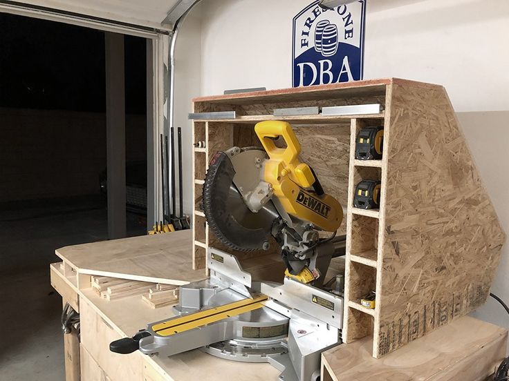 a work bench with tools on it in a garage