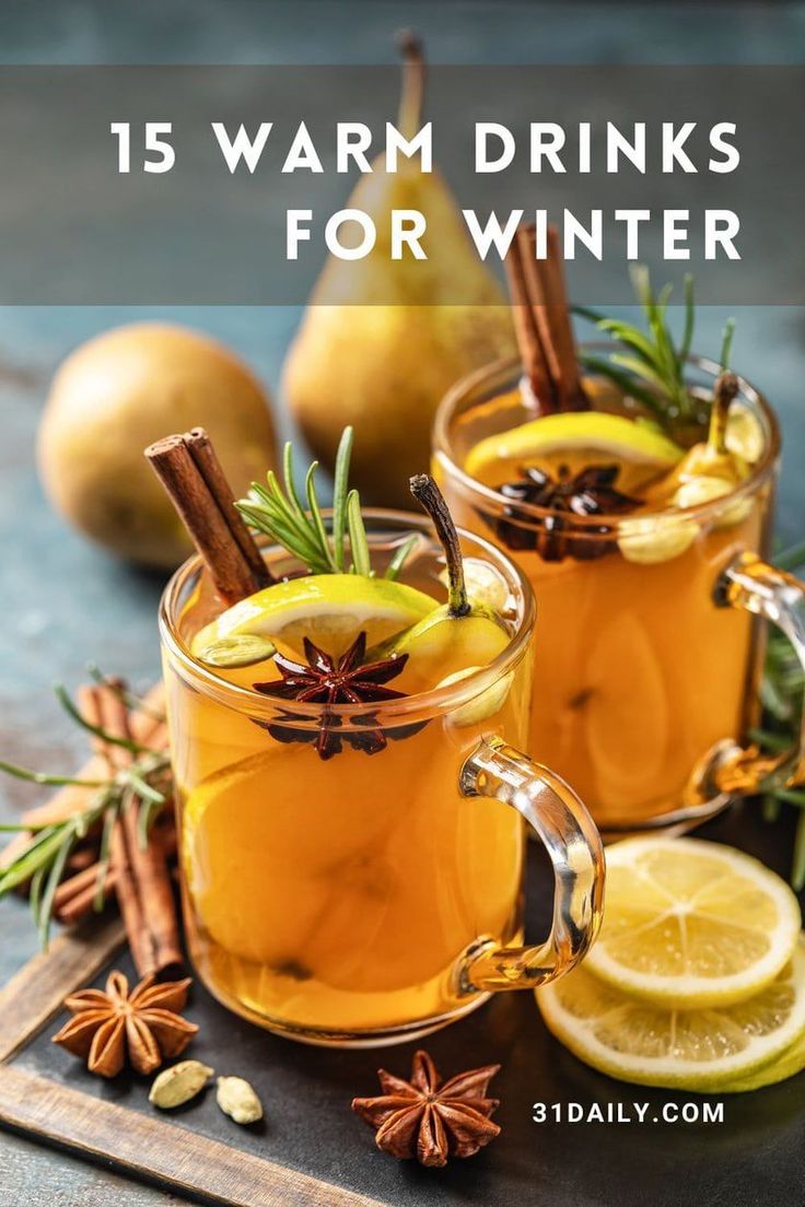 two mugs filled with cinnamon and apple cider