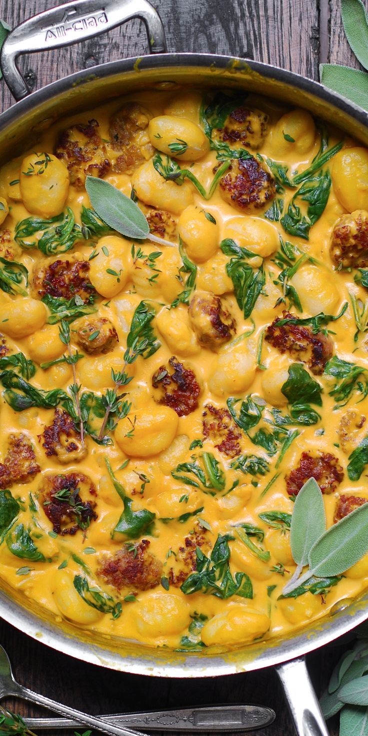 Creamy Pumpkin Gnocchi with Spinach and Italian Sausage in a stainless steel pan. Creamy Pumpkin Gnocchi With Spinach And Sausage, Creamy Pumpkin And Sausage Gnocchi, Creamy Pumpkin Gnocchi Recipes, Fall Recipes Gnocchi, Sweet Italian Sausage Gnocchi Recipes, Pumpkin Gnocchi With Sausage, Fall Soups Gnocchi, Pumpkin Puree Gnocchi, Pumpkin Spinach Gnocchi