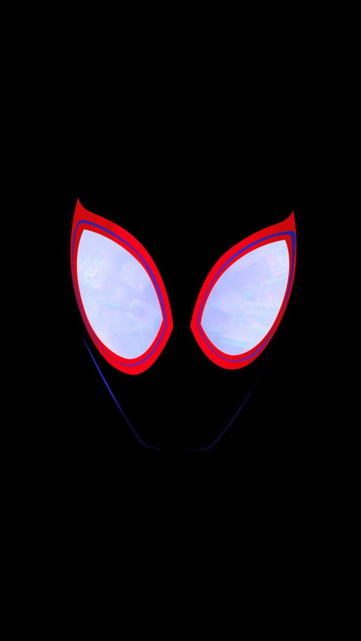 the face of an alien with red eyes and large, pointed ears on a black background